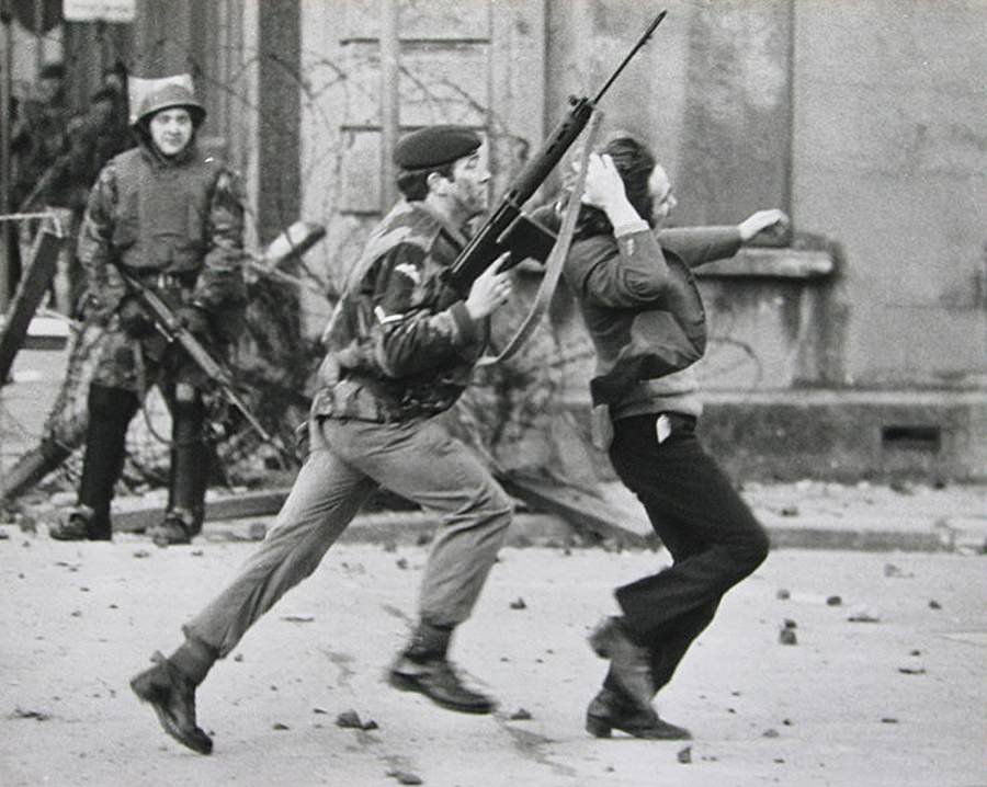 A Para grabs a youth by the hair as he arrests him in Derry on Bloody Sunday.